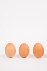 Chicken eggs  on white paper background