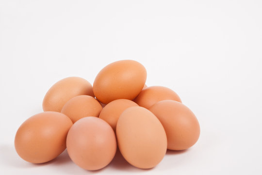 Chicken eggs  on white paper background