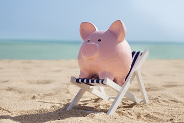 Piggy Bank With Deckchair - obrazy, fototapety, plakaty