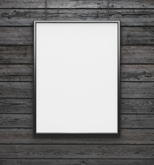 Black frame with blank canvas on the vintage wood background