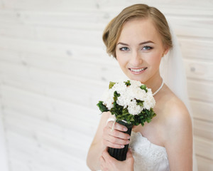 cheerful bride with a bouquet