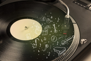 Turntable playing classical music with icon drawn instruments