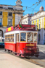 Obraz na płótnie Canvas Traditional yellow trams on a street in Lisbon, Portugal