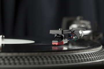Naklejka na ściany i meble Turntable playing vinyl close up with needle on the record