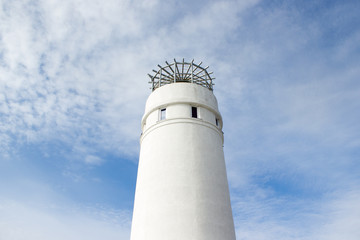 Lighthouse on a sunny day with blue sky