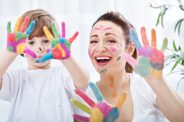 Happy smiling family with colorful hands