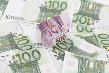 Obraz na płótnie Canvas 100 Euro Money with 500 Euro House