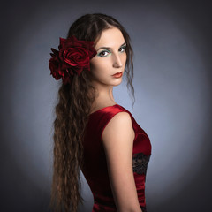 Beautiful young lady wearing red rose dress