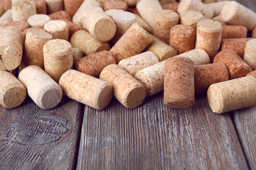 Wine corks on rustic wooden planks background