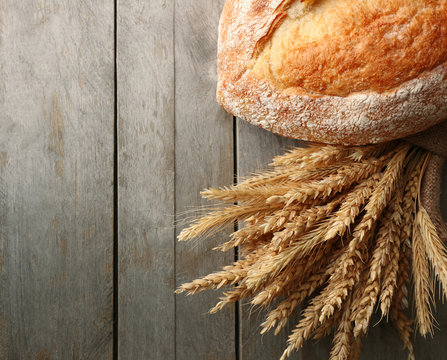 Bread with ears on wooden background