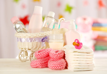 Baby accessories on table on light background