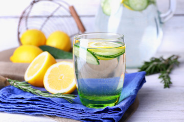 Fresh water with lemon and cucumber in glassware