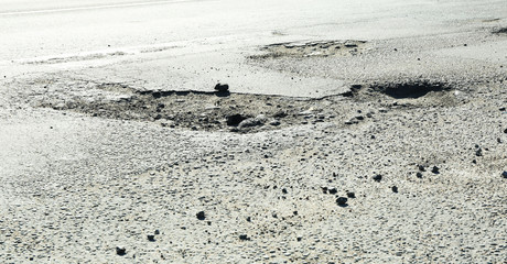 Very bad quality road with potholes