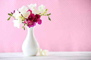 Beautiful spring flowers on pink background