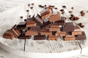 Pyramid of squared chocolate on wooden table