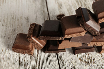 Pyramid of squared chocolate on wooden table
