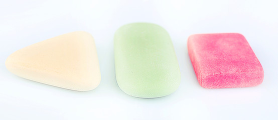 Three erasers isolated on white