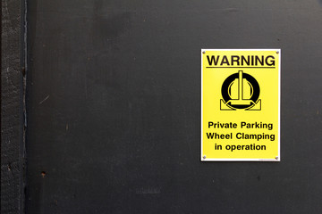 Traffic Sign: Warning - Private Parking - Wheel Clamping in Oper