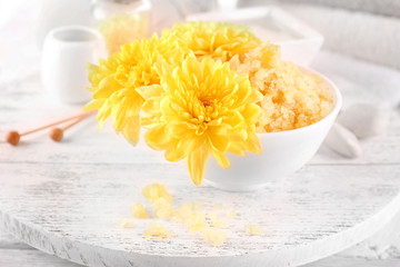 Spa still life with color sea salt on wooden table, closeup