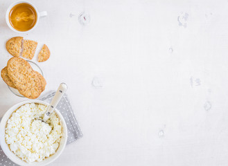 Healthy breakfast with cottage cheese, grain cookies, milk