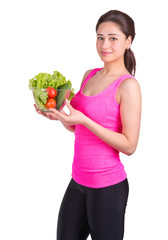 sports girl with a bowl of vegetables