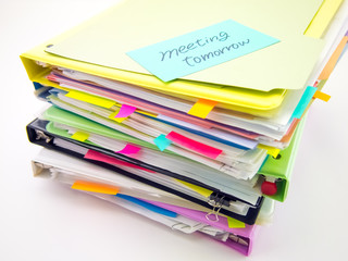 The Pile of Business Documents; Meeting Tomorrow