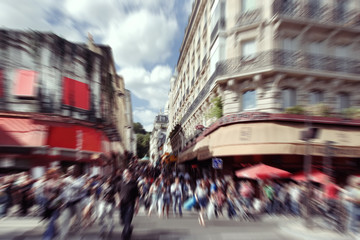 Abstract background.  Blurred crowd in  Paris - radial zoom blur