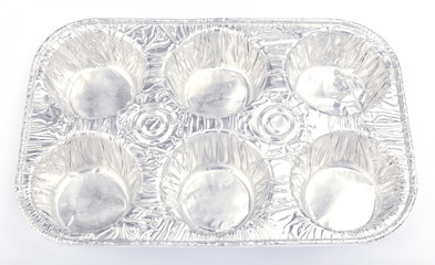 Aluminum foil baking tray for 6 cupcakes on white background.