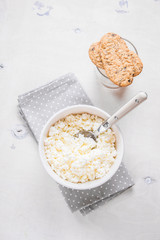 Healthy breakfast with cottage cheese, grain cookies, milk