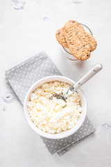 Healthy breakfast with cottage cheese, grain cookies, milk