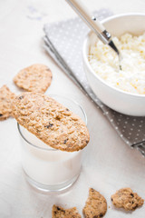 Healthy breakfast with cottage cheese, grain cookies, milk
