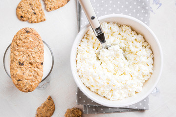 Healthy breakfast with cottage cheese, grain cookies, milk