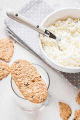 Healthy breakfast with cottage cheese, grain cookies, milk