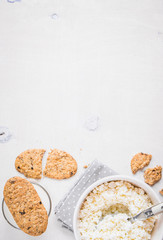 Healthy breakfast with cottage cheese, grain cookies, milk