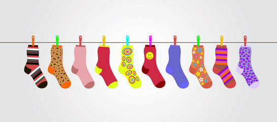 vector colorful socks on gray background are hanging on rope - 81019916