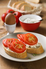 breakfast - bread with tomatoes and cream cheese
