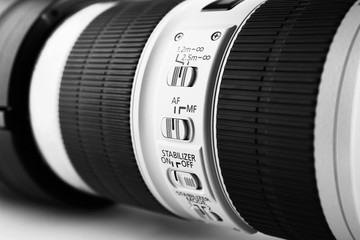 Camera lens on light background