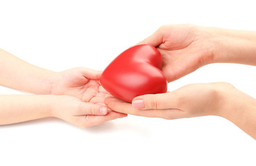 Heart in child and mother hands isolated on white