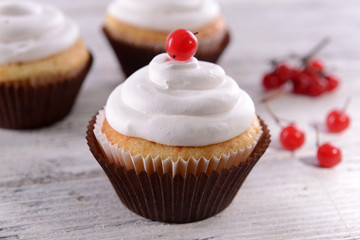 Delicious cupcakes on table close-up