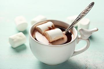 Hot chocolate with marshmallows in mug,