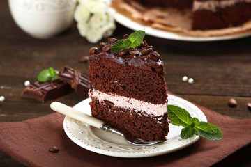 Delicious chocolate cake on table close-up