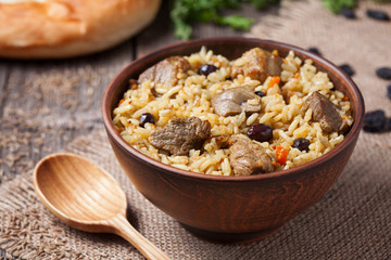 Traditional uzbek food called pilaf cooked with fried lamb meat