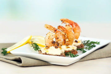 Appetizer canape with shrimp and lemon