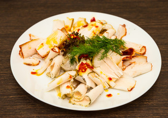 Salted lard with red pepper on a plate