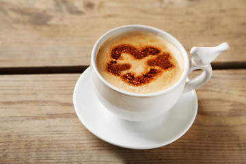Cup of coffee on old wooden table