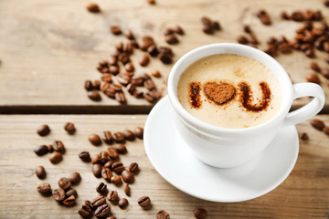 Cup of coffee on old wooden table