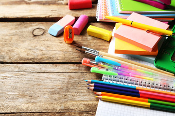Fototapeta premium Bright school stationery on old wooden table