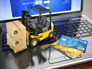 Concept of delivering, shipping or logistics. Forklift on laptop