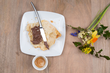 Breakfast -Croissant with chocolate and coffee