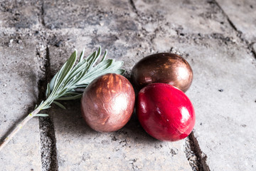 Easter eggs  with rosemarry on stone background